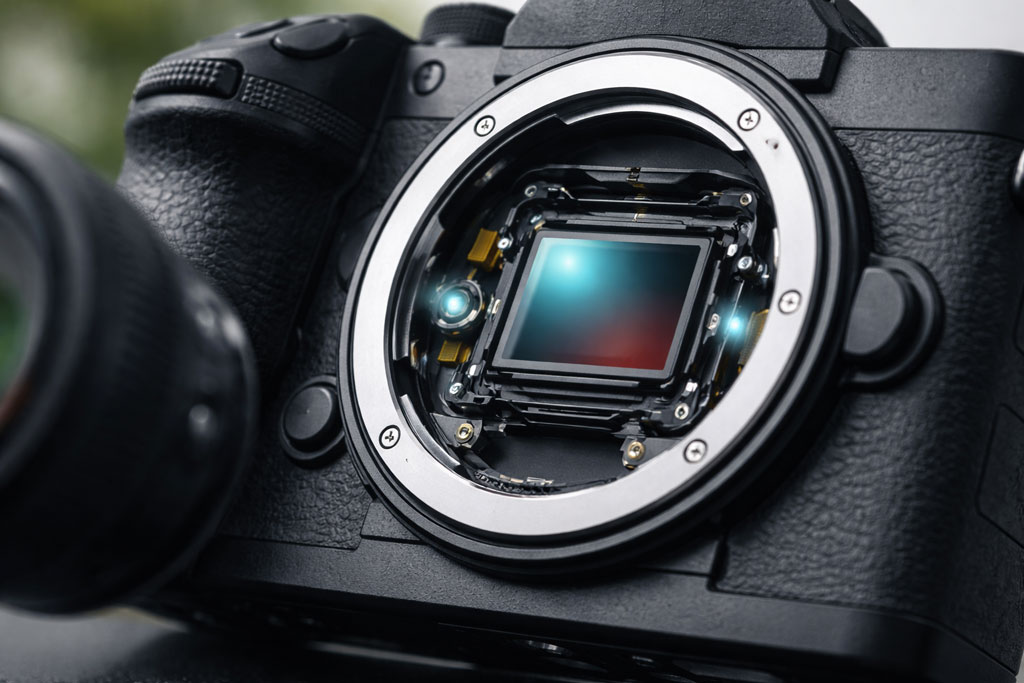 Mirrorless camera showing in-body image stabilisation technology in a natural light setting